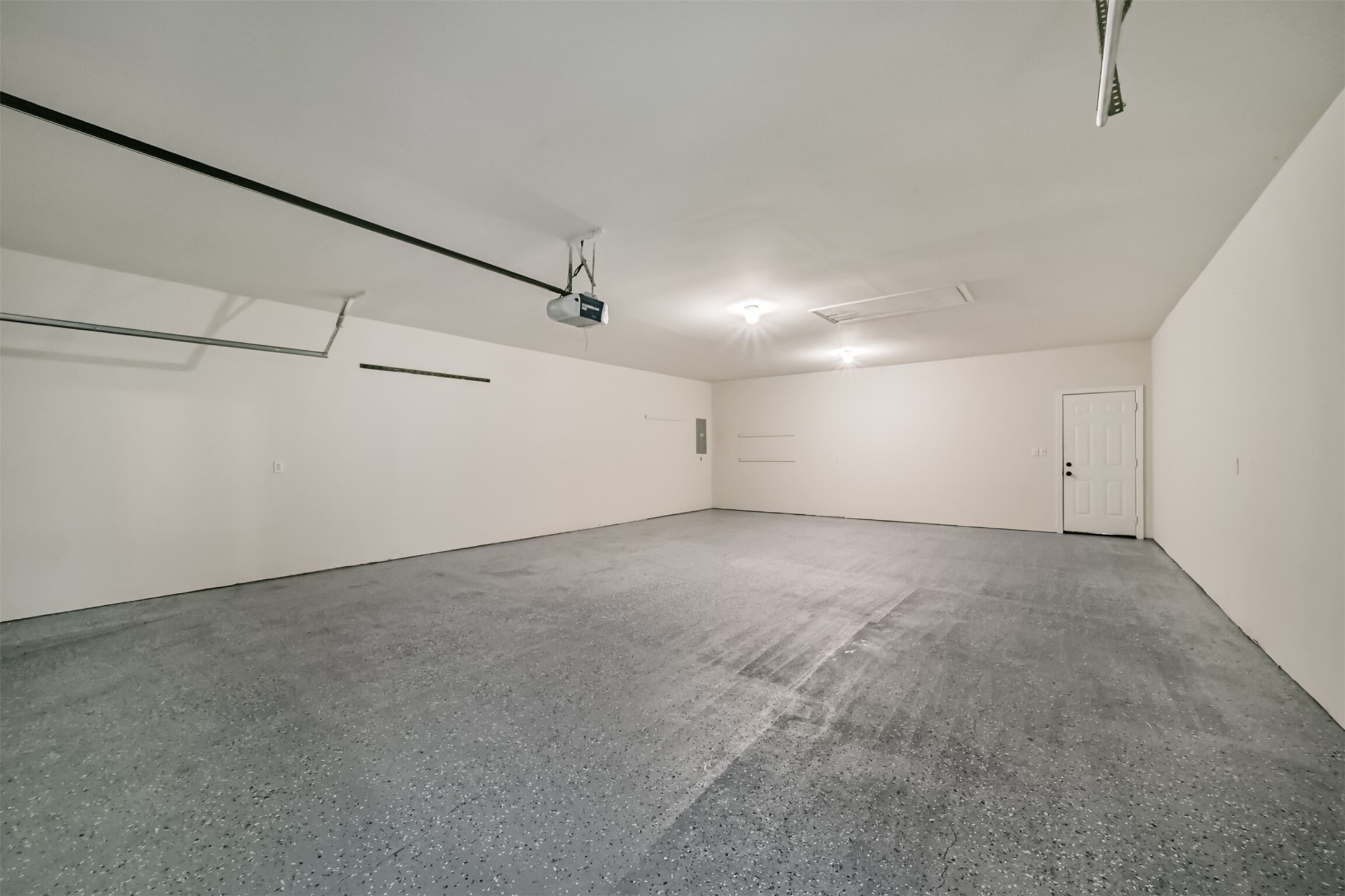 27322 Afton Way Huffman, TX 77336 - Photo 44 of 50 Massive oversized garage provides exceptional storage, workspace potential, and plenty of room for multiple vehicles.