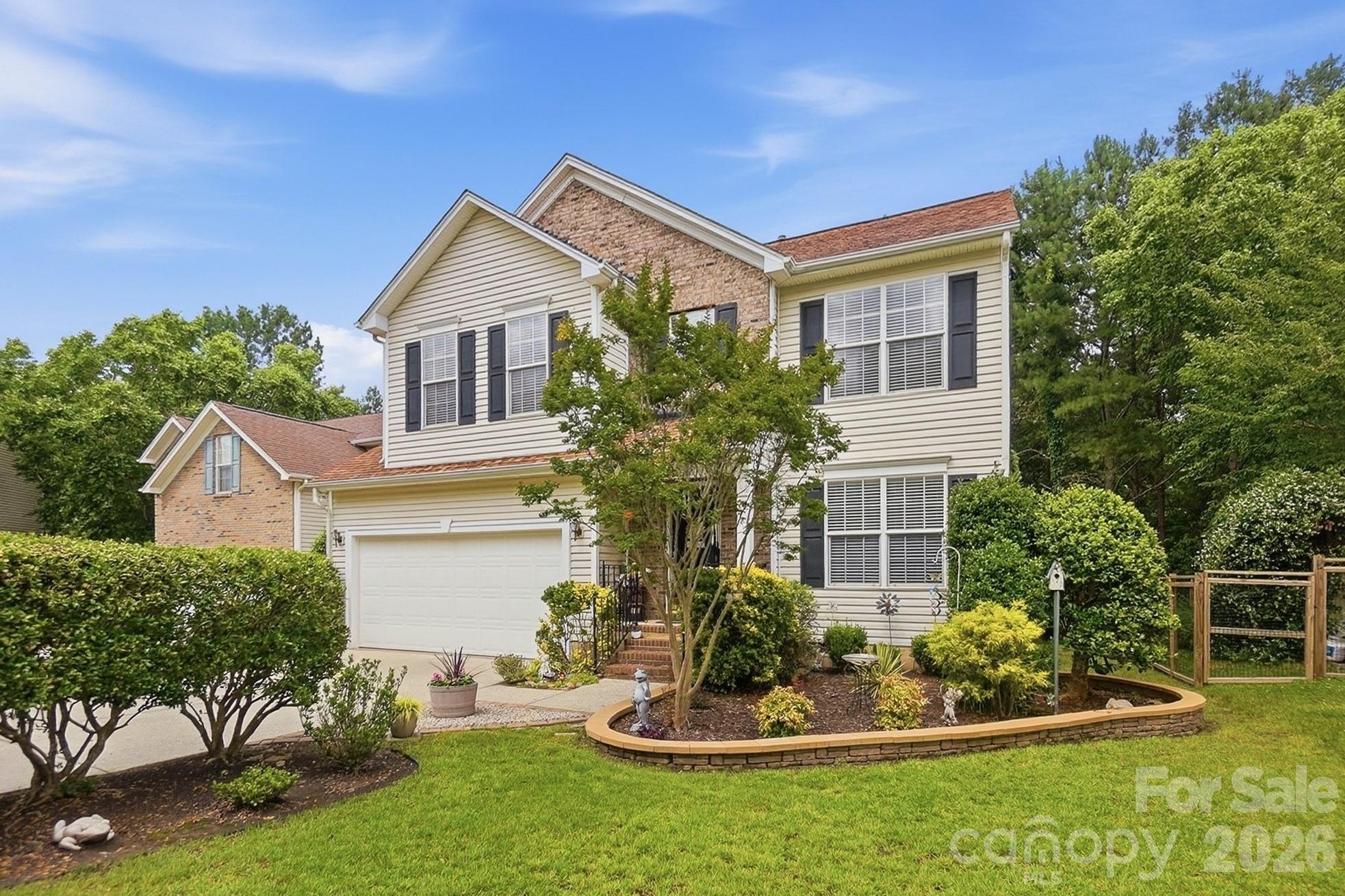 442 Sugar Maple Drive Tega Cay, SC 29708 - Photo 3 of 48 a front view of a house with a yard