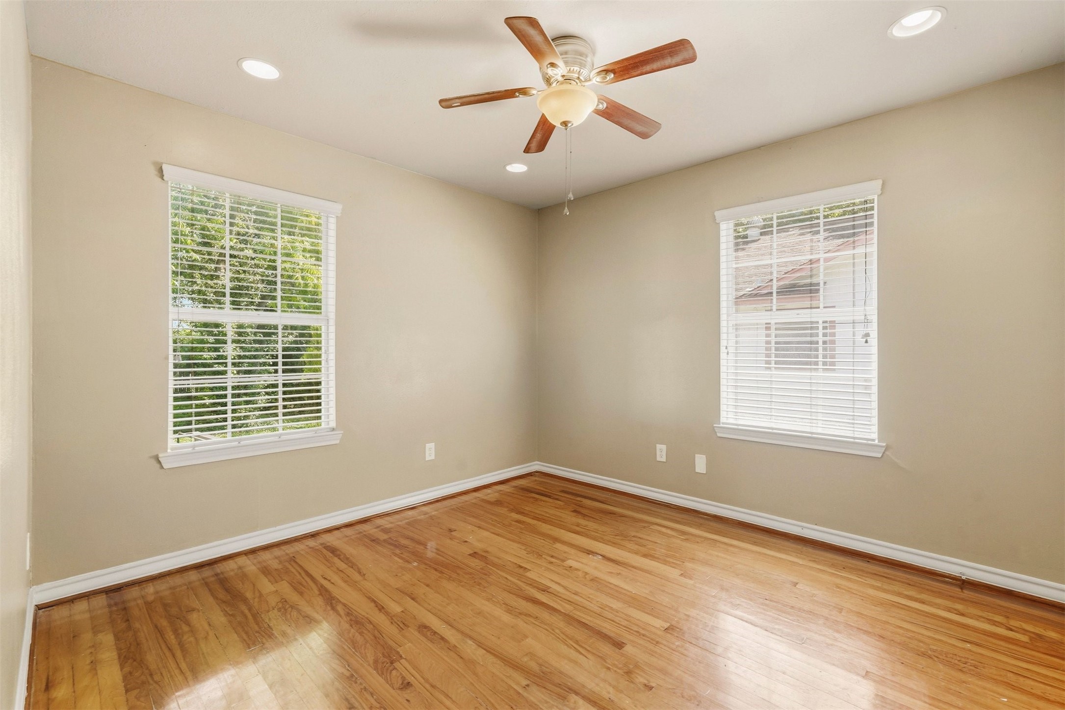 3445 Nathaniel Brown Street Houston, TX 77021 - Photo 15 of 19 a view of an empty room with a window and wooden floor