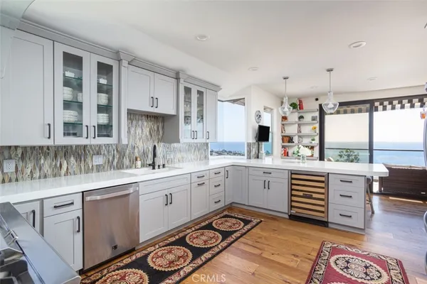 a bathroom with a granite countertop sink toilet and a mirror