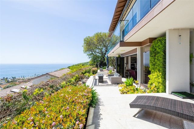 a balcony with furniture and city view