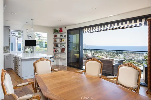 a dining room with furniture a window and a fireplace