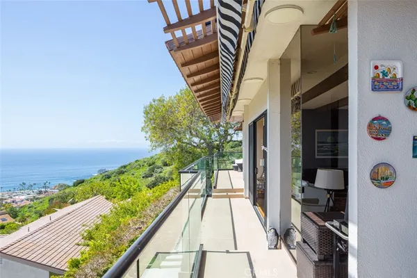 a view of a balcony with furniture