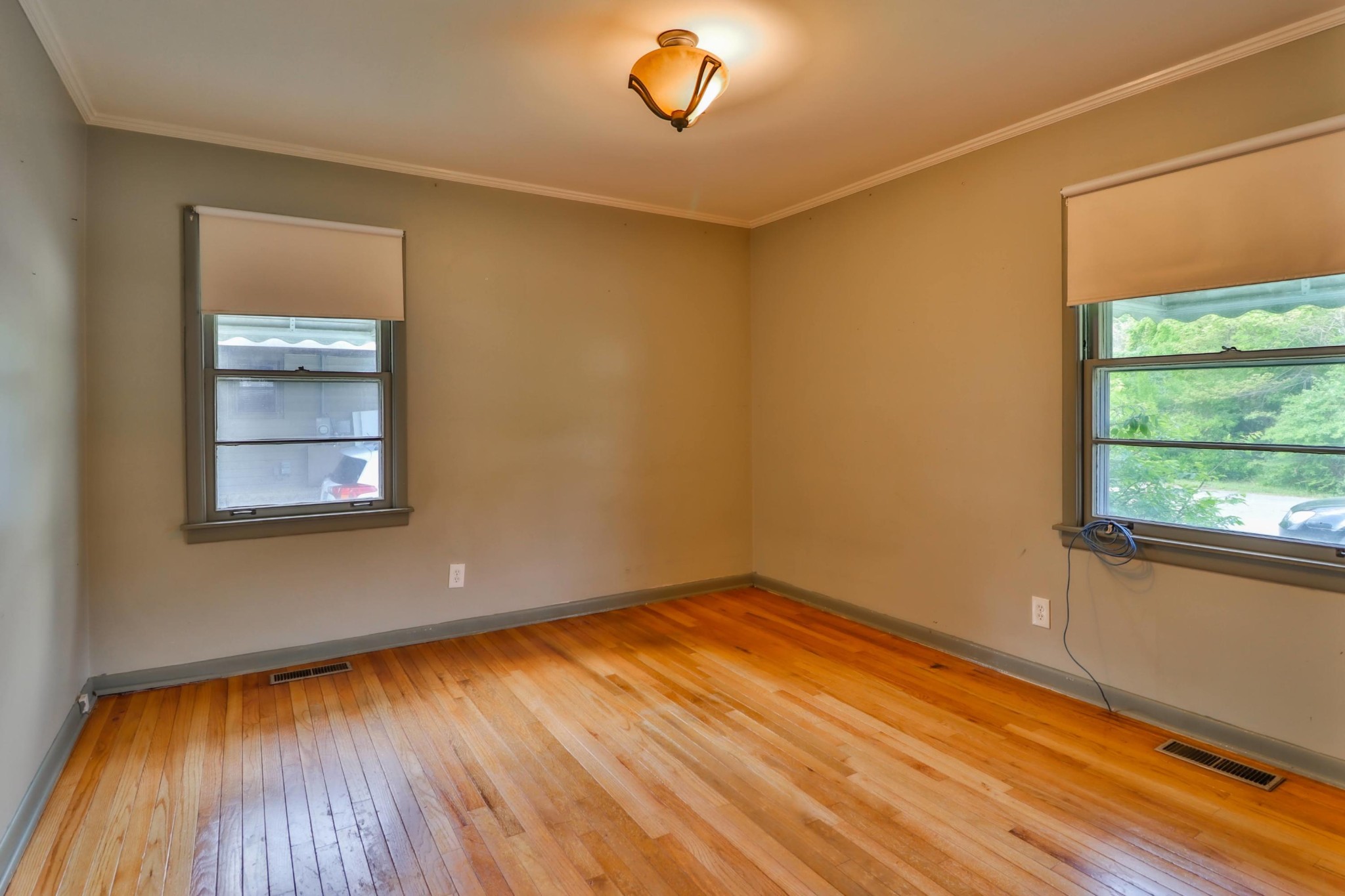 103 South Seneca Road Oak Ridge, TN 37830 - Photo 16 of 26 a view of empty room with wooden floor and fan