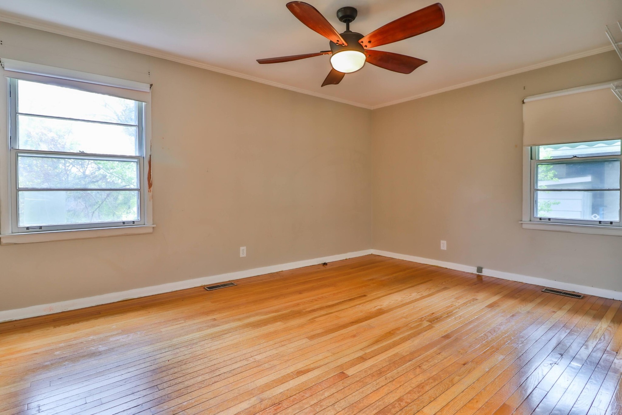 103 South Seneca Road Oak Ridge, TN 37830 - Photo 18 of 26 a view of empty room with wooden floor and fan