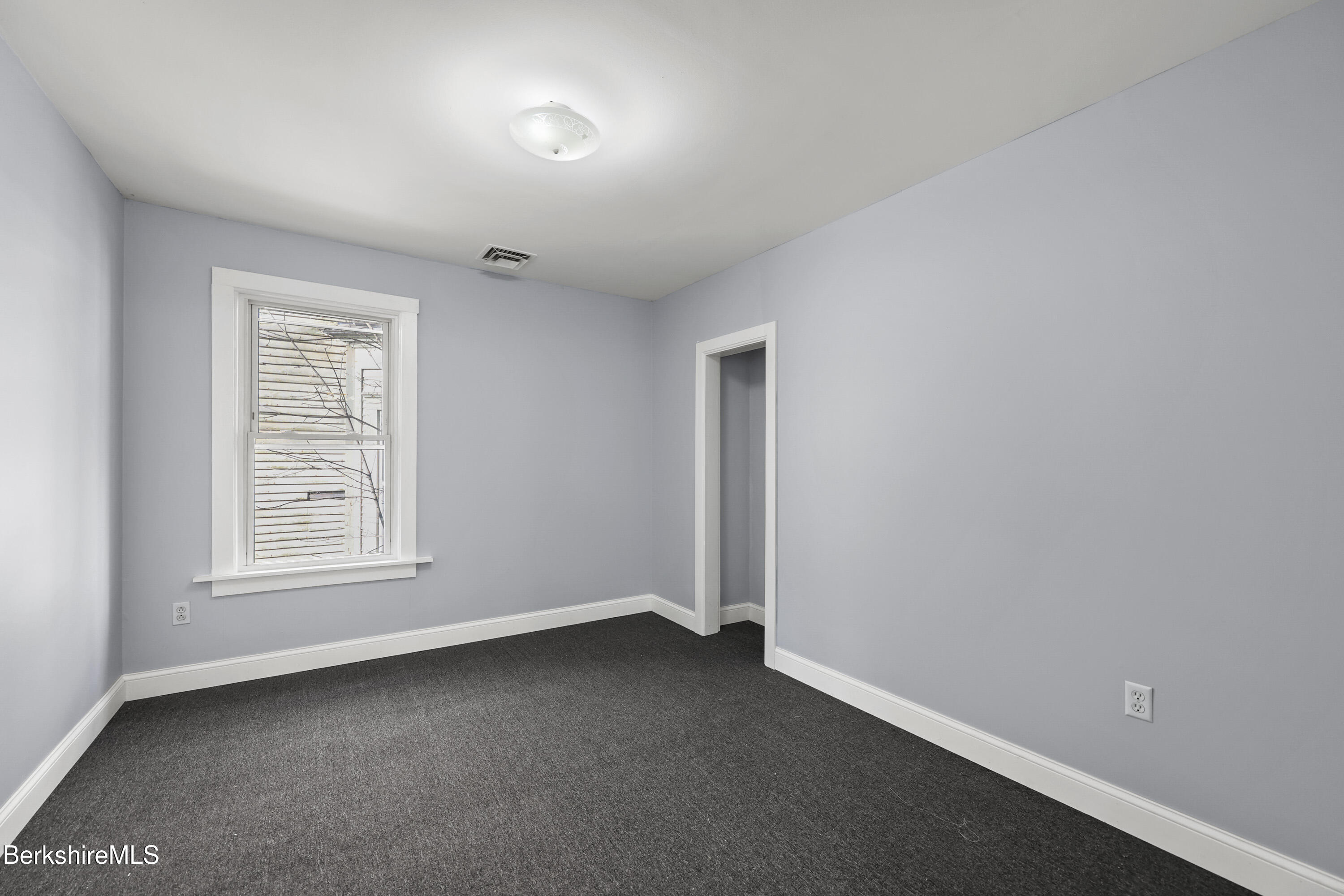 73-75 Hall Street North Adams, MA 01247 - Photo 19 of 32 an empty room with a window