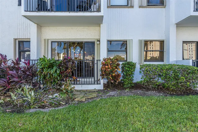 a view of a chairs and table in the balcony