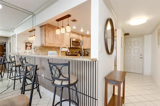 a dining room with furniture and a window