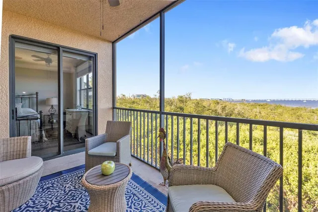a view of balcony with furniture