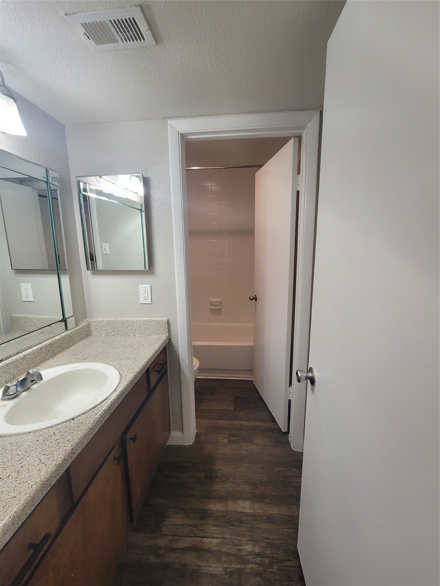 7250 West Greens Road, Unit 1202 Houston, TX 77064 - Photo 8 of 10 a bathroom with a granite countertop sink toilet and shower