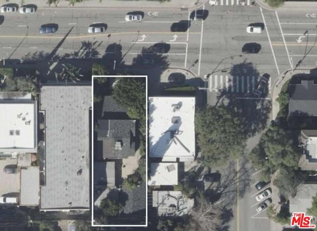 view of a brick house with a potted plant