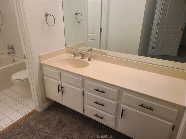 a bathroom with a shower and a bath tub
