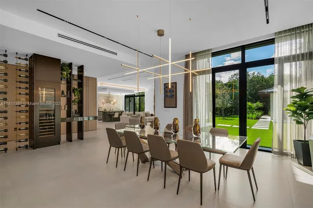 a dining room with furniture window and outside view