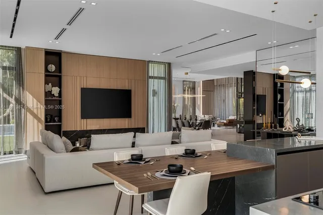 a living room with fireplace furniture and a flat screen tv