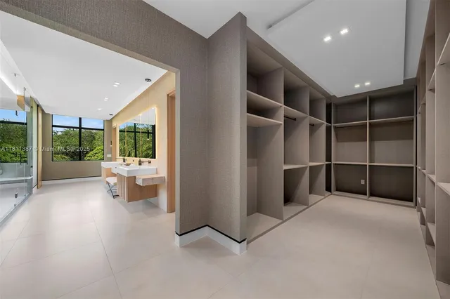 a view of hallway with wooden floor and windows