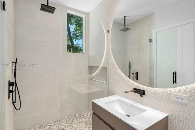 a kitchen with a sink and a washer dryer