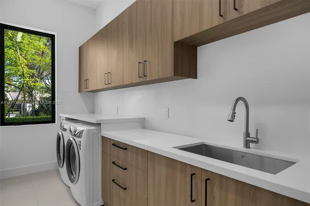 a bathroom with a sink and mirror with toilet