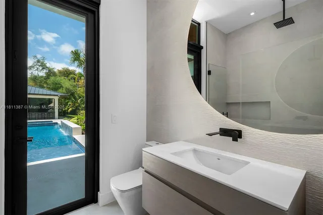 a view of a house with pool yard and a patio