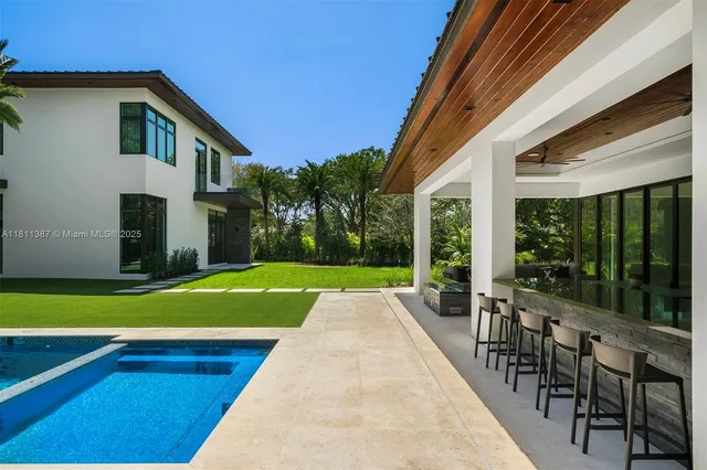 a bathroom with a sink a mirror and shower