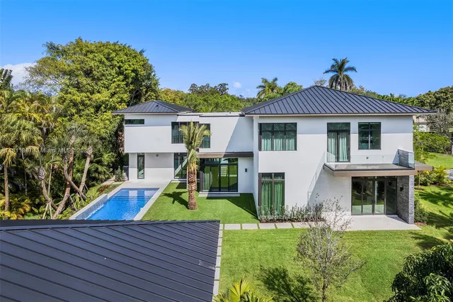an aerial view of a house with a garden