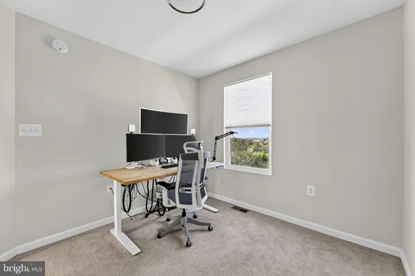 a view of a workspace with furniture