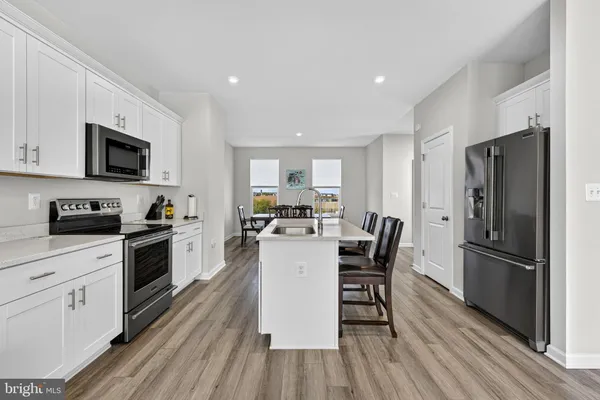 a dining room with furniture and wooden floor