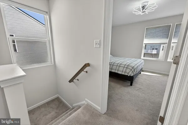 a bedroom with a large bed and a flat screen tv