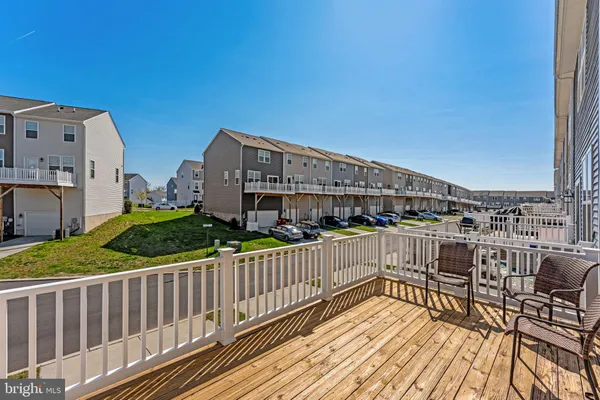 a view of a house with roof deck and sitting area