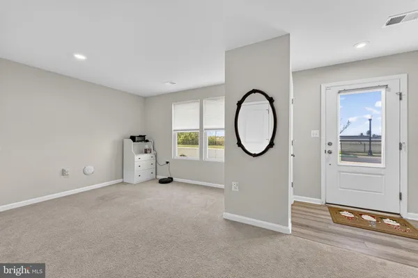 a view of a room with gym equipment and a large window