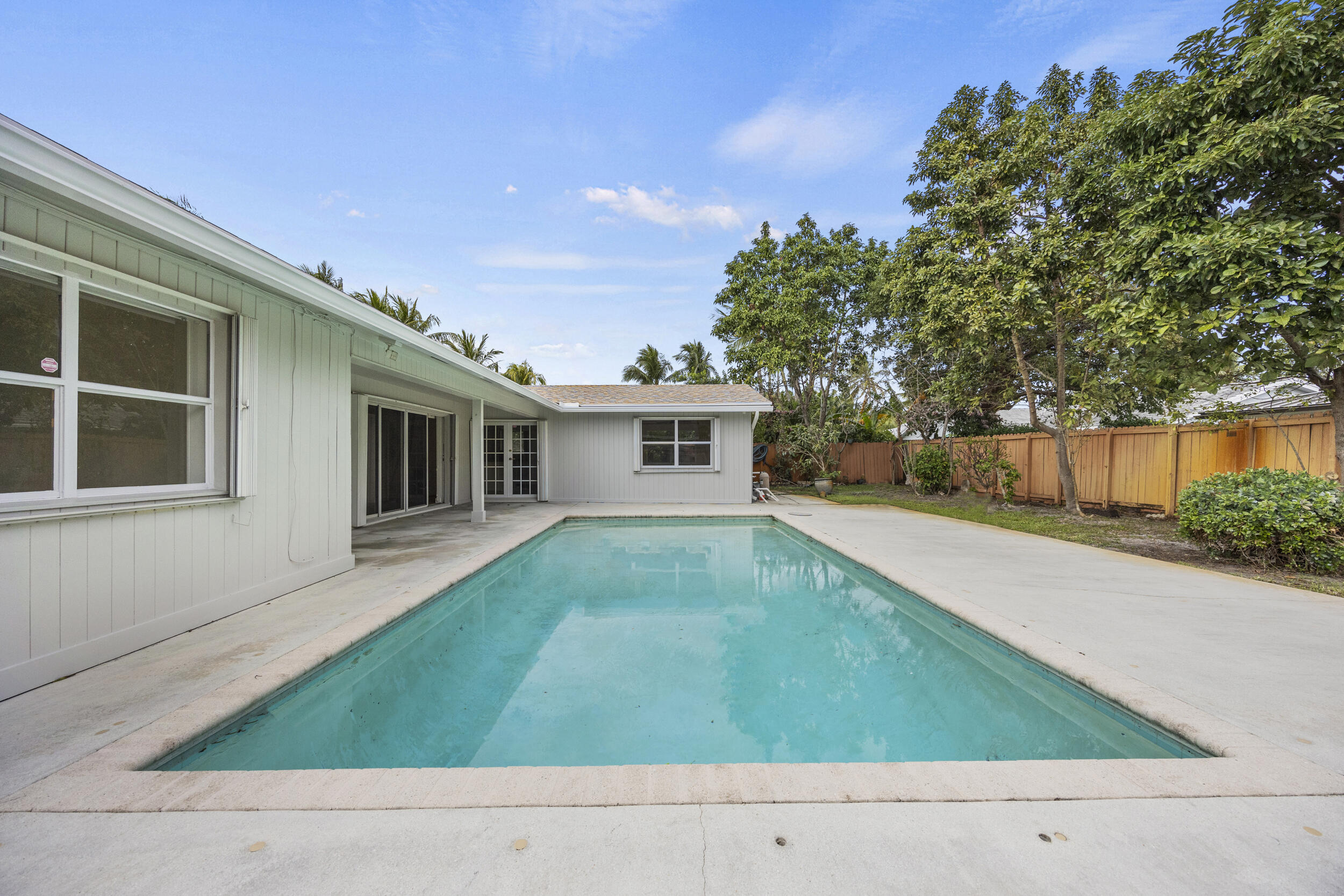 723 Southwest 27th Terrace Boynton Beach, FL 33435 - Photo 43 of 54 Backyard Patio w/ Inground Pool