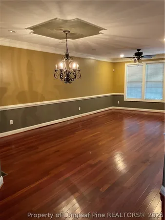 a view of a room with wooden floor