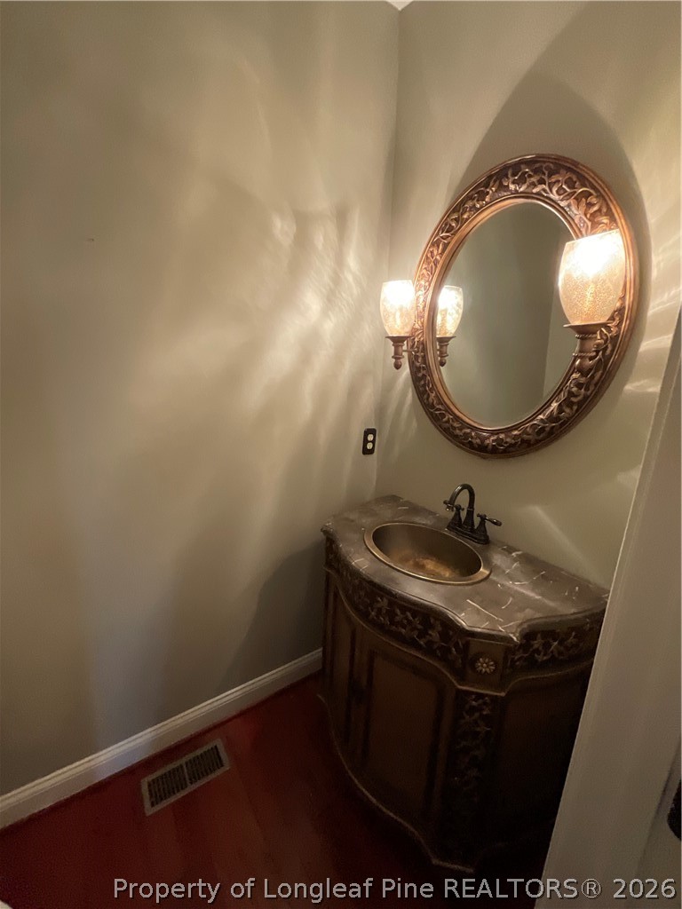 67 Hawk Ridge Drive Spring Lake, NC 28390 - Photo 15 of 32 a bathroom with a sink and a mirror