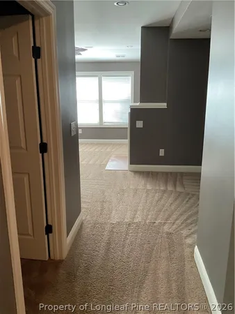 a view of room with a ceiling fan