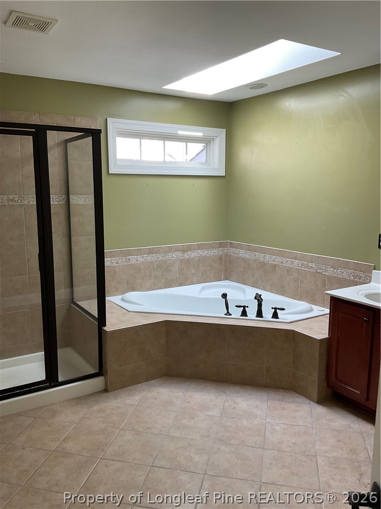 67 Hawk Ridge Drive Spring Lake, NC 28390 - Photo 27 of 32 a bathroom with a bathtub and shower