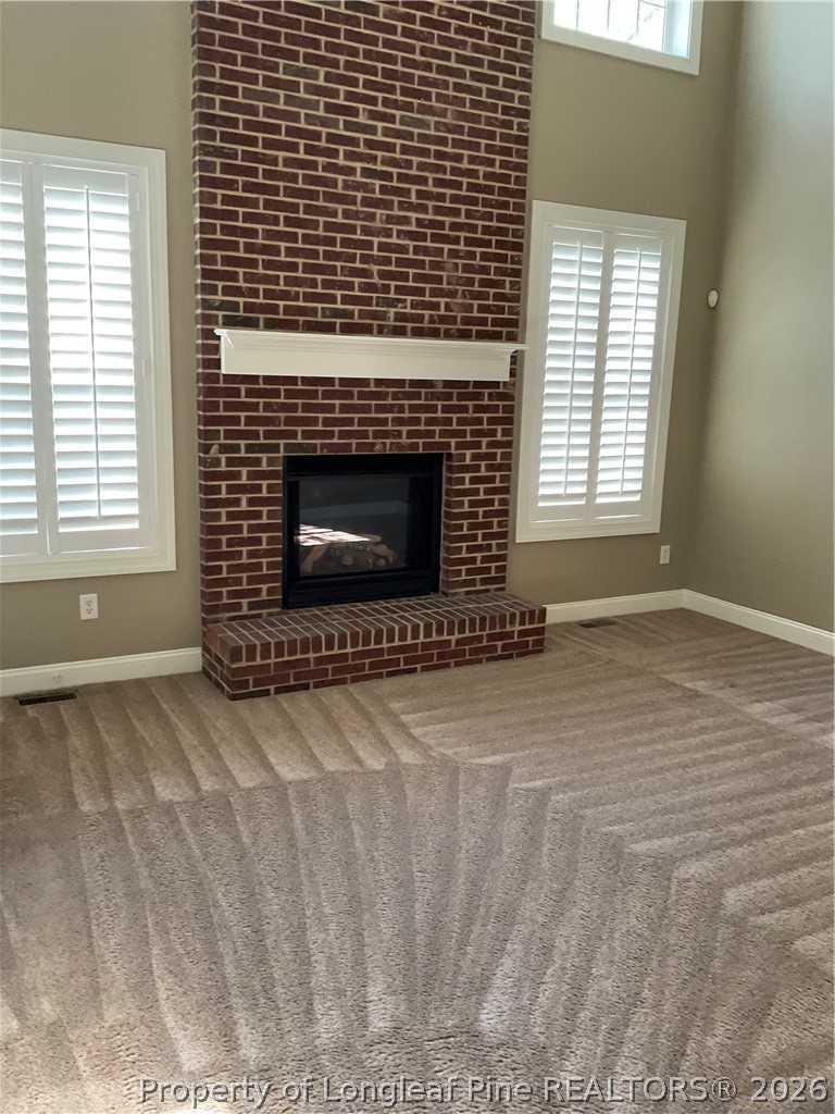 67 Hawk Ridge Drive Spring Lake, NC 28390 - Photo 3 of 32 a view of an empty room with a fireplace