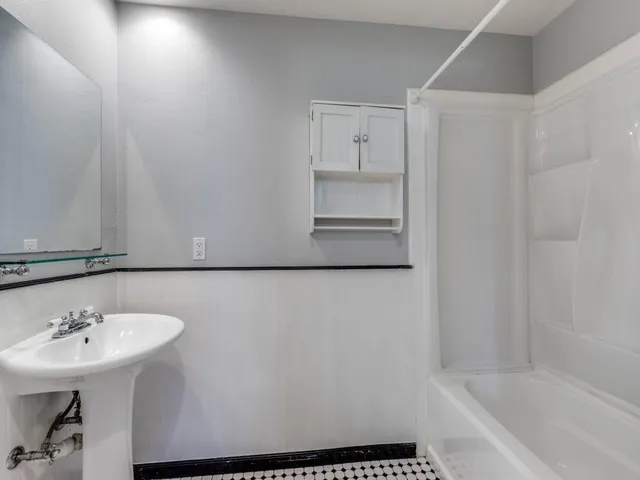 a bathroom with a sink and a bathtub