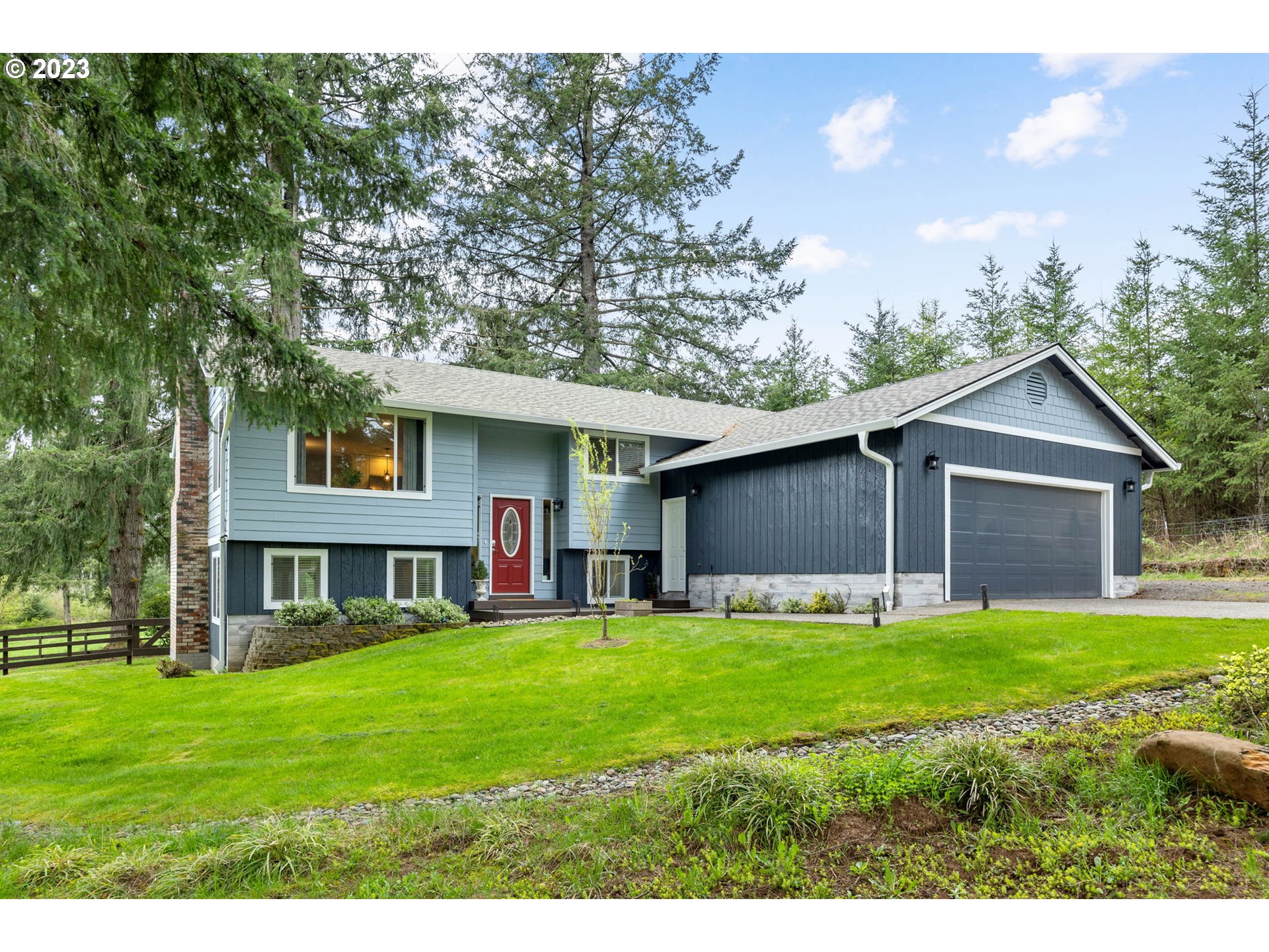 4412 Northeast 292nd Avenue Camas, WA 98607 - Photo 1 of 48 a view of a yard in front of a house with a yard