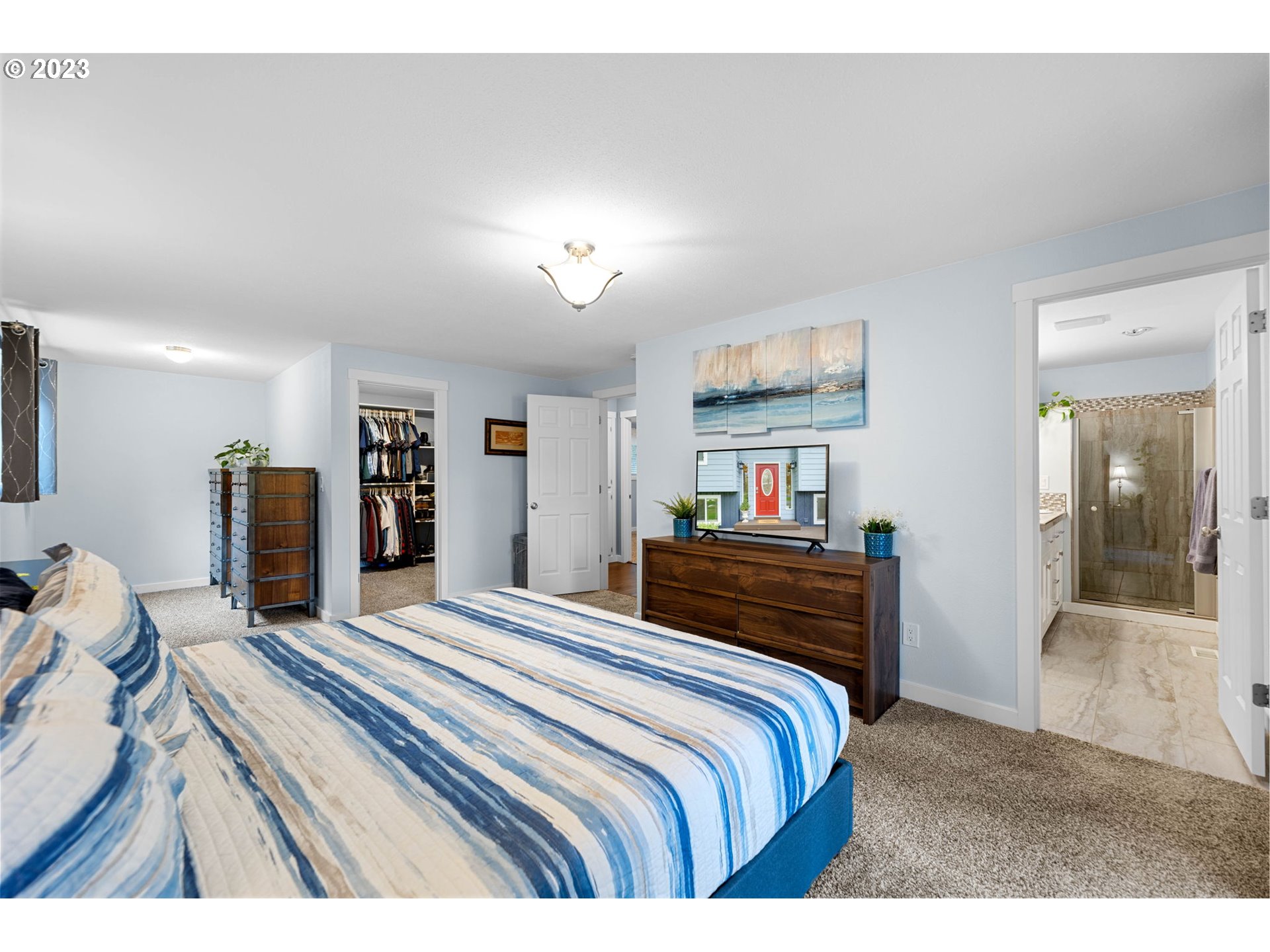 4412 Northeast 292nd Avenue Camas, WA 98607 - Photo 16 of 48 a bedroom with a bed and a dresser