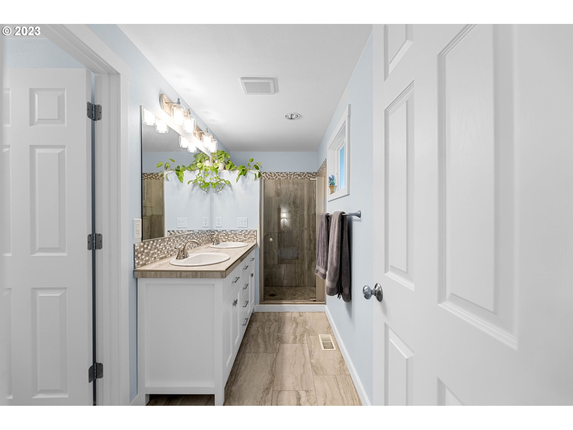 4412 Northeast 292nd Avenue Camas, WA 98607 - Photo 17 of 48 a bathroom with a sink a mirror and a shower