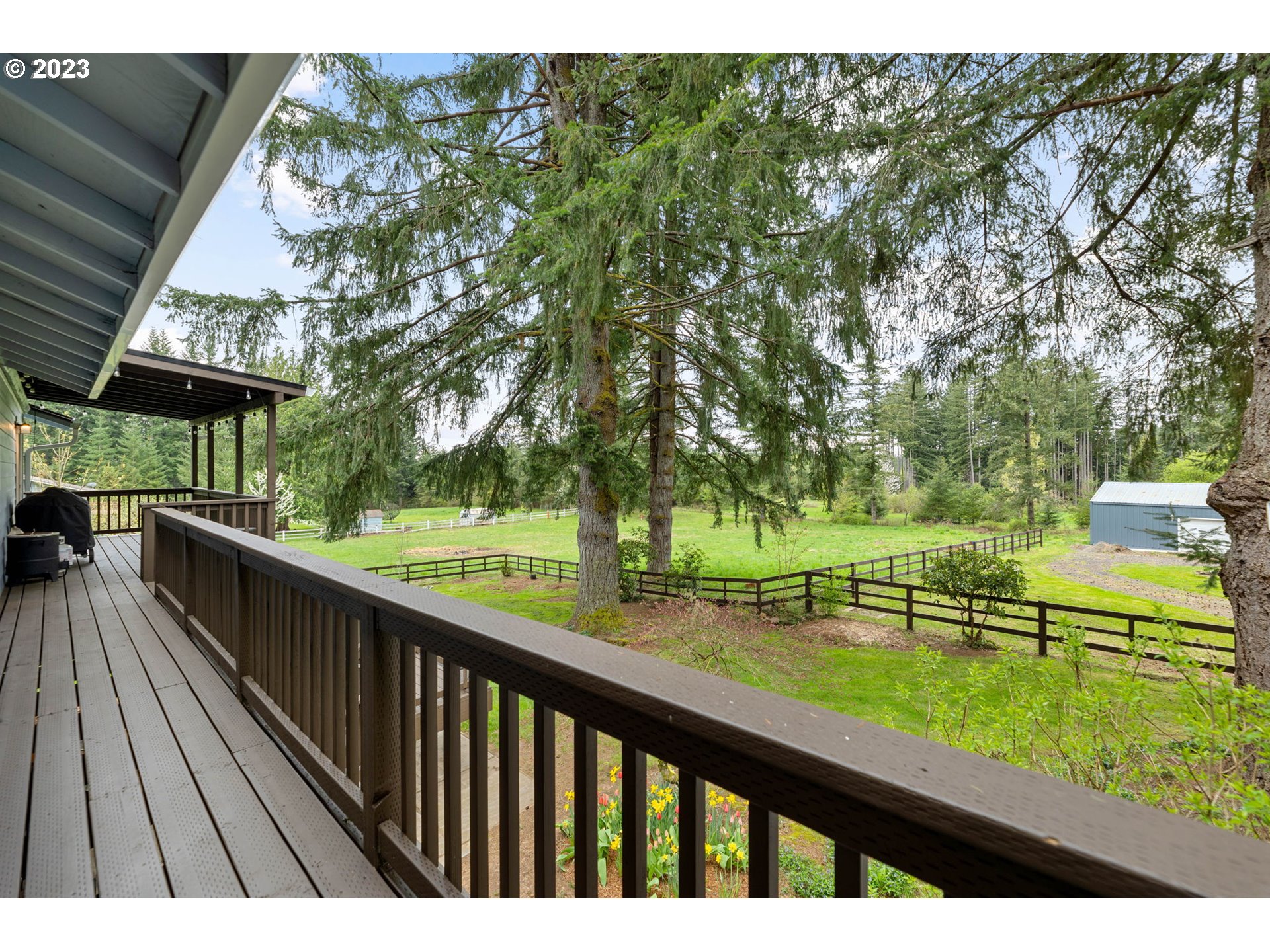 4412 Northeast 292nd Avenue Camas, WA 98607 - Photo 20 of 48 a view of a wooden deck with a yard