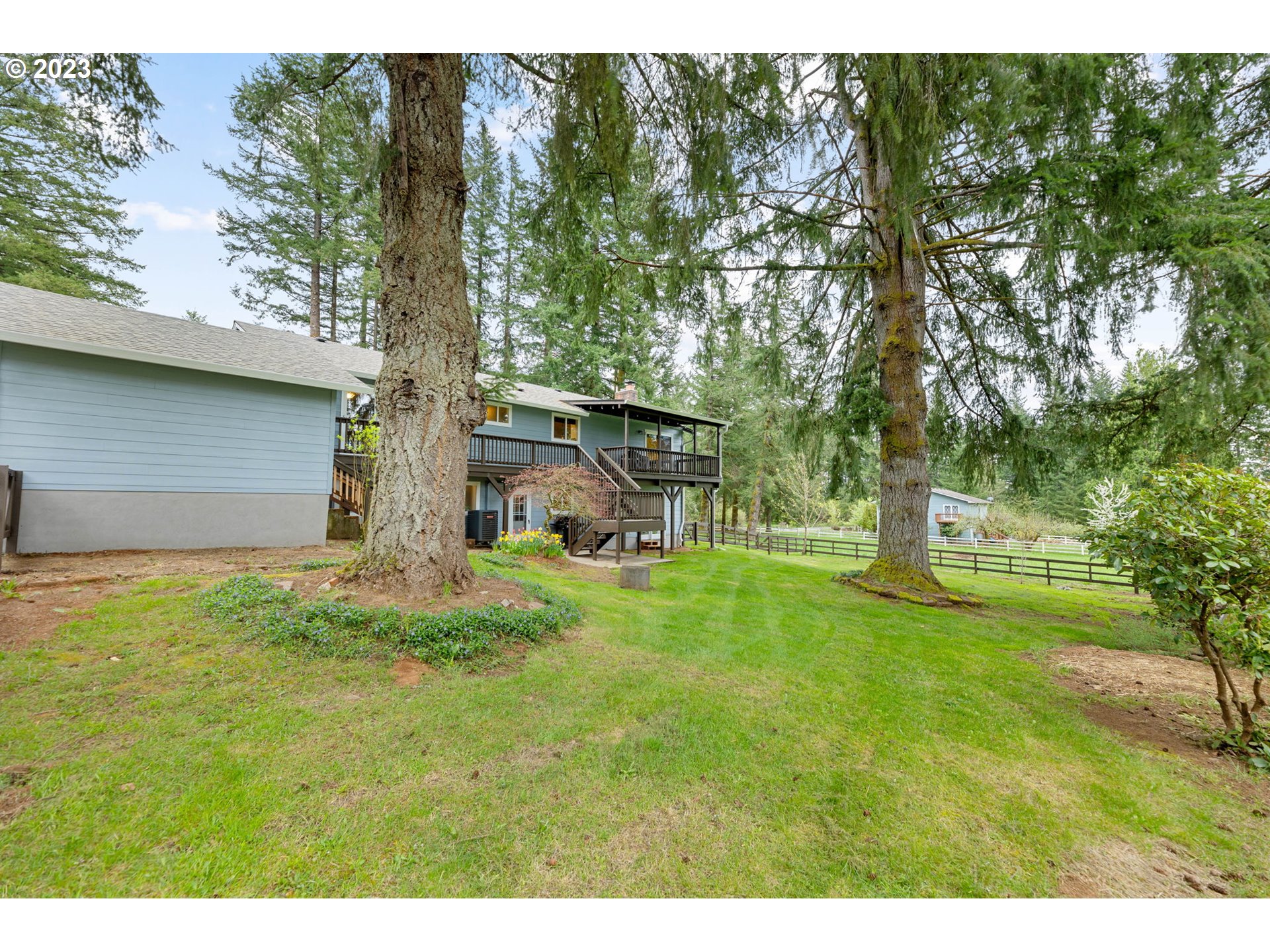 4412 Northeast 292nd Avenue Camas, WA 98607 - Photo 37 of 48 a view of a backyard with large trees