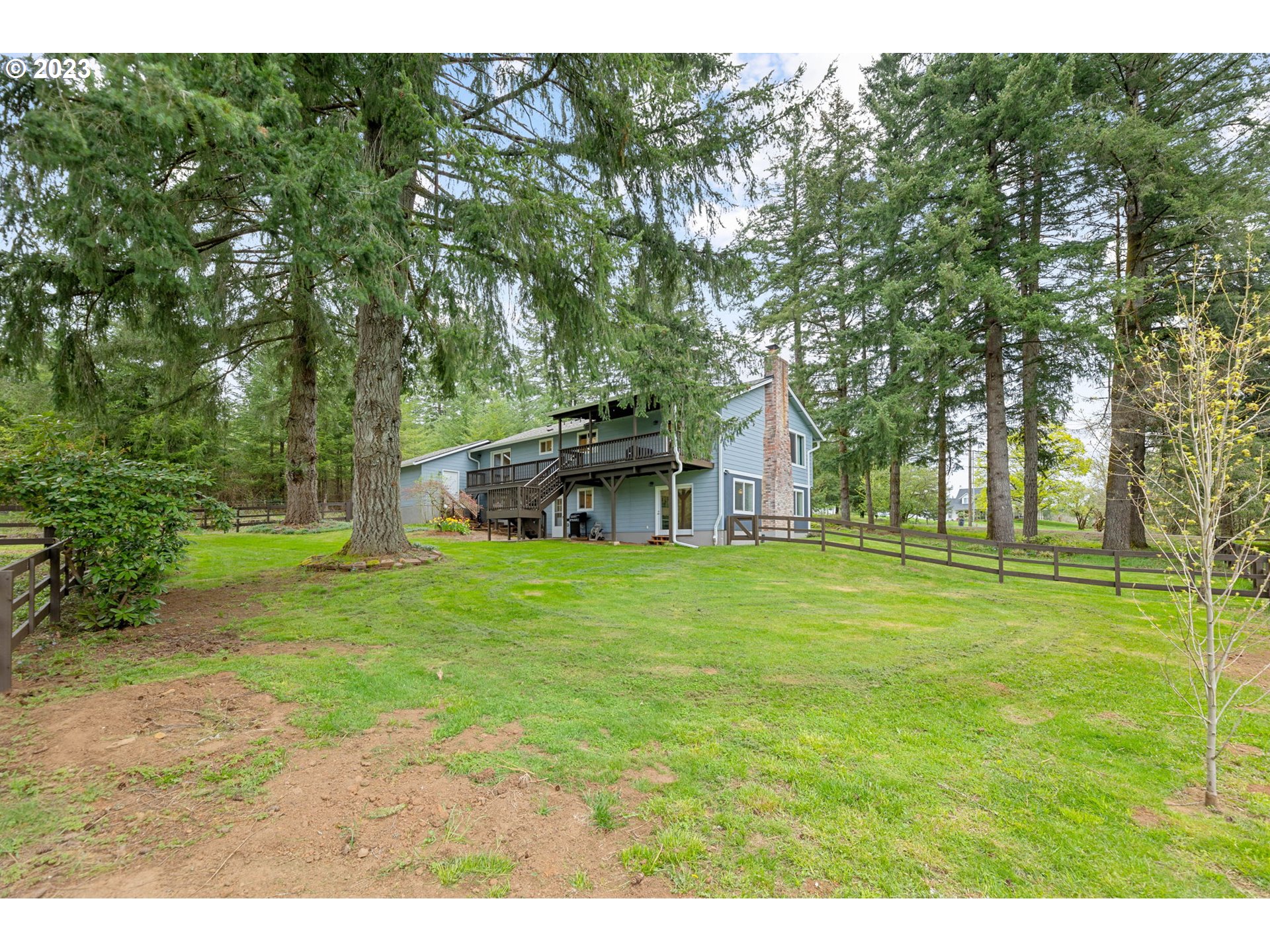 4412 Northeast 292nd Avenue Camas, WA 98607 - Photo 39 of 48 a backyard of a house with table and chairs