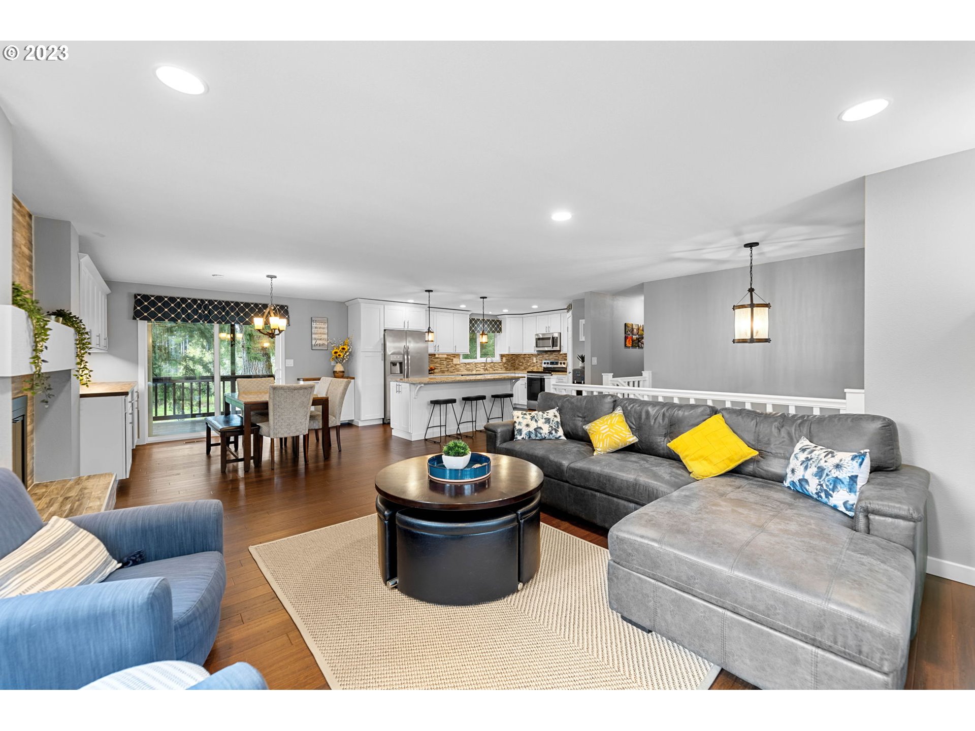 4412 Northeast 292nd Avenue Camas, WA 98607 - Photo 6 of 48 a living room with furniture a rug and kitchen view