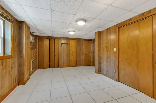 a view of room with wooden floor and window