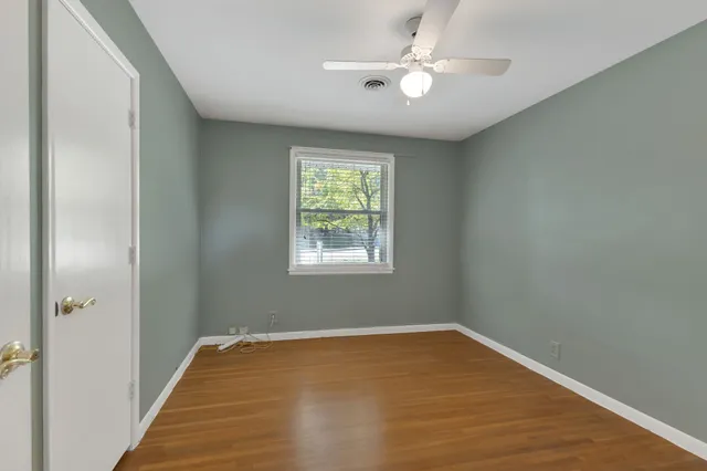 a bathroom with a toilet a sink and a mirror