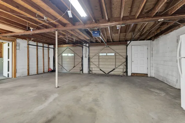 a view of an empty room with gym equipment