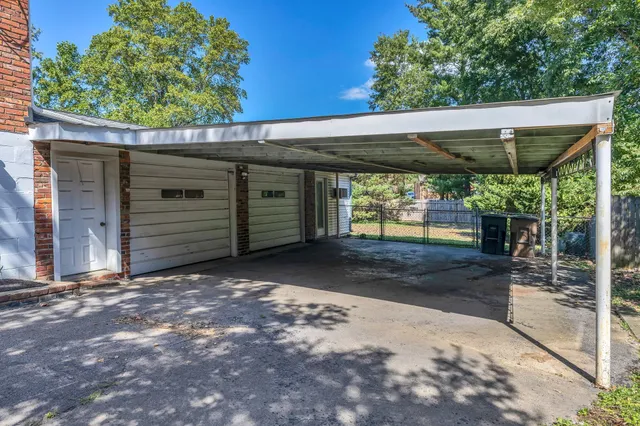 a view of a hallway with wooden walls
