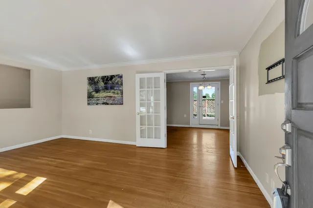 a view of livingroom with hardwood floor and hallway