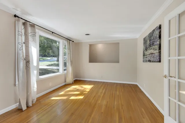 a view of wooden floor in an empty room