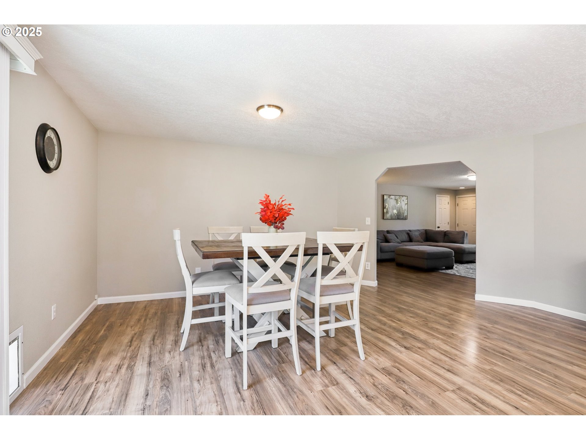 29495 Southwest Yosemite Street Wilsonville, OR 97070 - Photo 11 of 40 a dining room with furniture and wooden floor